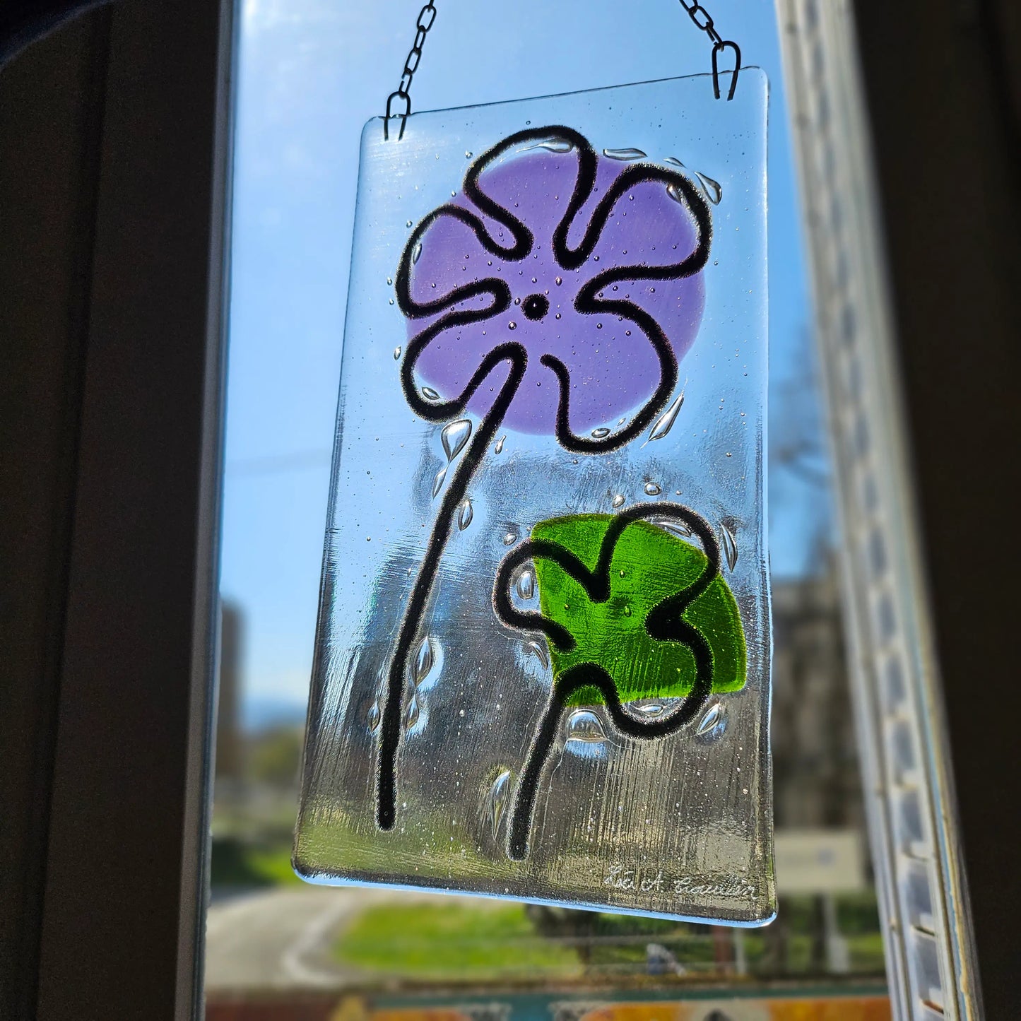 Attrape soleil fleur violette