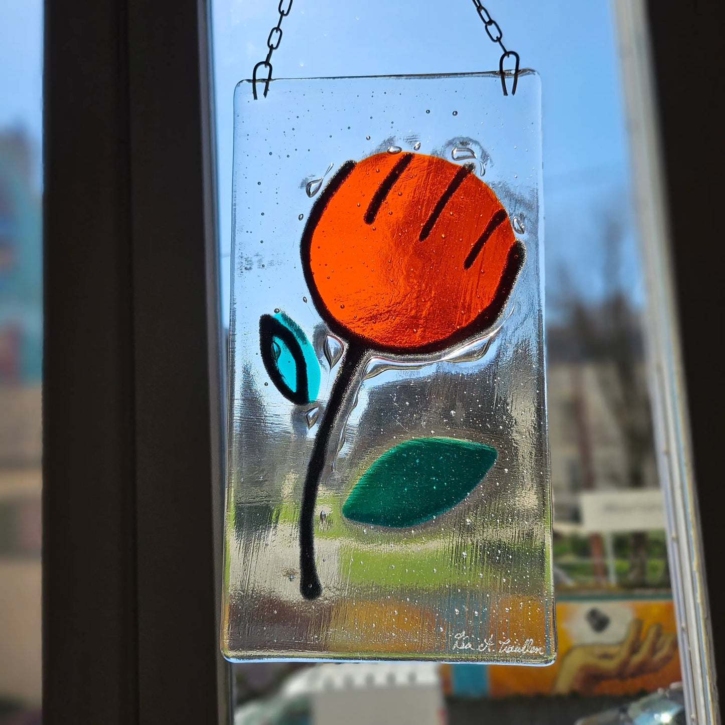 Attrape soleil fleur orange